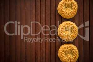Moon cakes on bamboo mat dark light with copy space