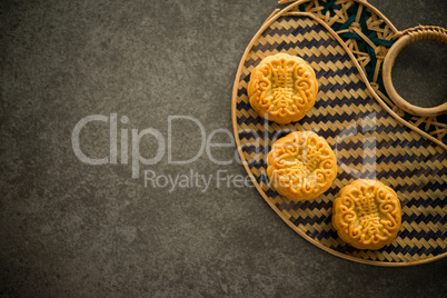 Mooncakes on bamboo background low light with copyspace