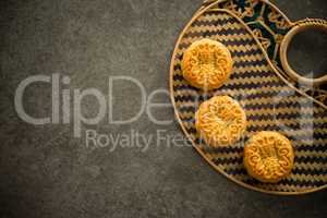 Mooncakes on bamboo background low light with copyspace