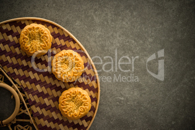 Moon cakes on bamboo background low light with copyspace