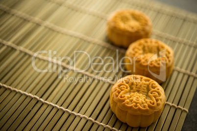 Moon cakes on bamboo mat with copy space