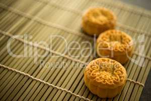 Moon cakes on bamboo mat with copy space