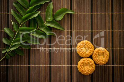 Top down moon cakes on bamboo mat
