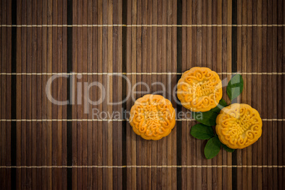 Top down mooncakes on bamboo mat with copy space