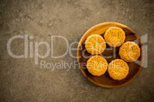 Moon cakes on dark background with copy space