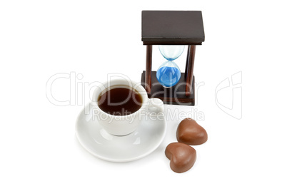 Hourglass and a cup of coffee isolated on white background.