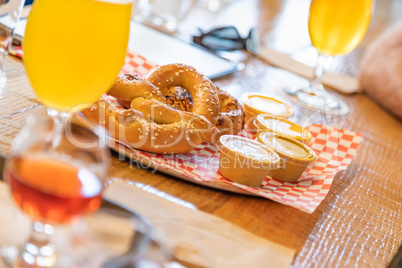 Abstract of Small Glass of Micro Brew Beers and Warm Pretzels