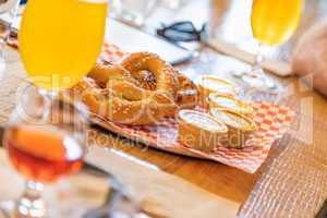 Abstract of Small Glass of Micro Brew Beers and Warm Pretzels