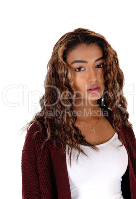 Portrait of serious teen with curly long hair