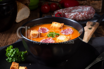 Hungarian paprika cream soup with spicy sausage