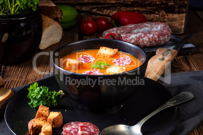 Hungarian paprika cream soup with spicy sausage