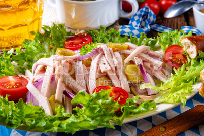 delicious bavarian sausage salad with onion and cucumbers