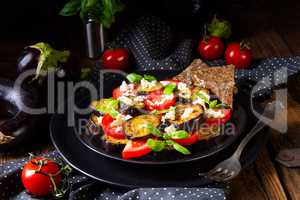 Eggplant grilled with aromatic feta cheese and tomatoes