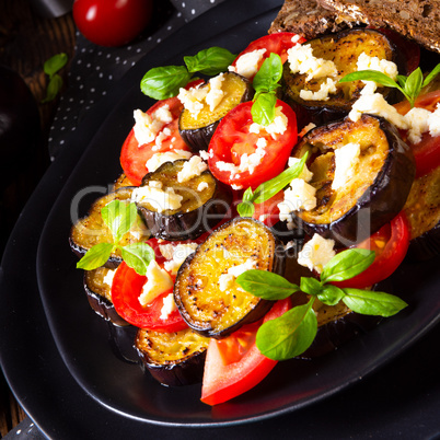 Eggplant grilled with aromatic feta cheese and tomatoes