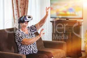 Senior woman with virtual headset or 3d glasses playing
