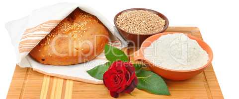 Bread, grain and flour isolated on white background. Wide photo.