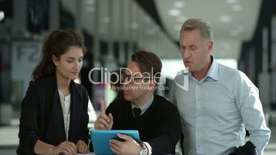 Business people looking at a digital tablet
