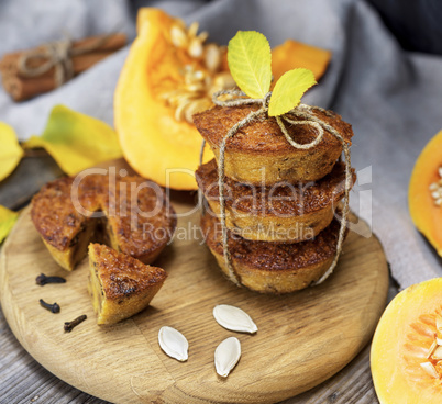 stack of muffins with a pumpkin