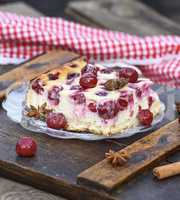 piece of cottage cheese pie and canned cherries