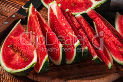 Slices of ripe watermelon lying on the board