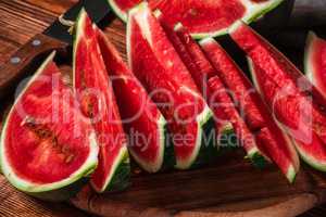 Slices of ripe watermelon lying on the board
