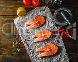 Three Raw Salmon Steaks with Spices