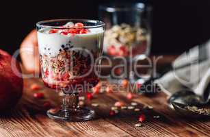 Pomegranate Parfait with Ingredients on Backdrop