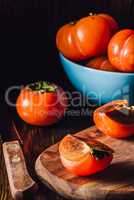 Sliced Persimmon on Wooden Board.