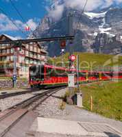 red electric tourist train goes from the station Jungfraujoch top of Europe Kleine Scheidegg, Bernese Oberland, Switzerland, Europe