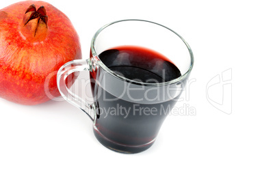 Glass of pomegranate juice with fruit isolated on white. Healthy
