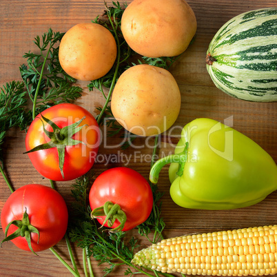 Vegetables laid out on a wooden table.