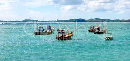 Beautiful seascape with fishing boats on the water. Wide photo.