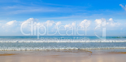 Deserted sandy beach of the Indian Ocean and blue sky, Wide phot