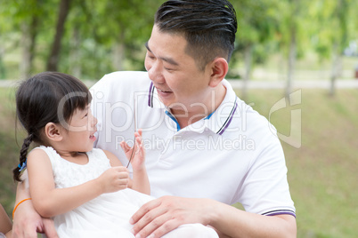 Father and daughter at park