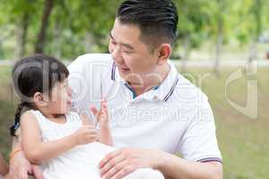 Father and daughter at park