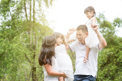 Portrait of Asian family at outdoor.