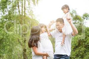 Portrait of Asian family at outdoor.