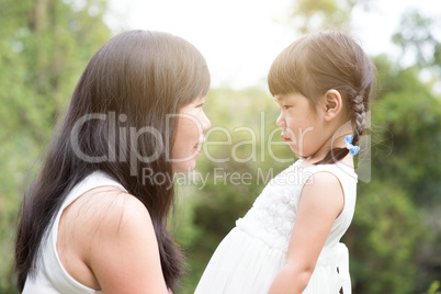 Asian mother and daughter at outdoors.