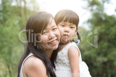 Asian mother and daughter outdoor portraits.