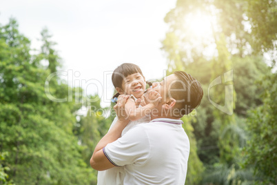 Happy father and daughter having fun outdoors.