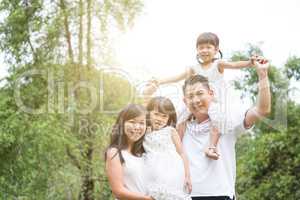 Asian family outdoor portrait.