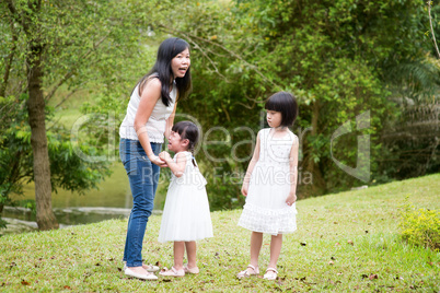 Mother comforting crying daughter