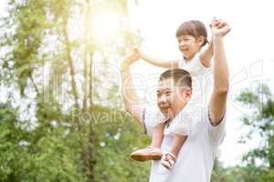 Father piggyback daughter.