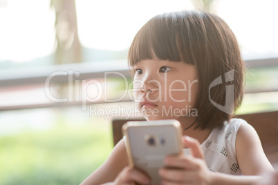 Little child addicted to smart phone