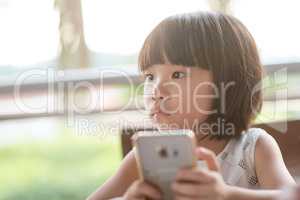 Little child addicted to smart phone