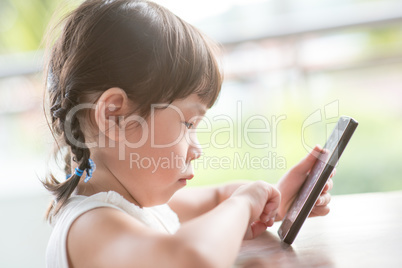 Little girl using smart phone