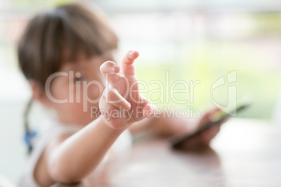 Little girl addicted to smart phone