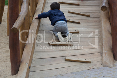 Little boy having fun on a playground