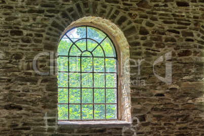 Old factory windows in an old abandoned workshop