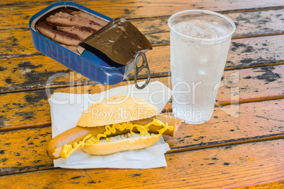 Bockwurst in bun, a can of fish